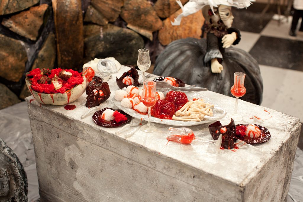 A gory dinner appears atop a crypt in the Blue team's creation called "Venetian Crypts" made during the final "spine chiller" challenge, as seen on Food Network's Halloween Wars, Season 5.
